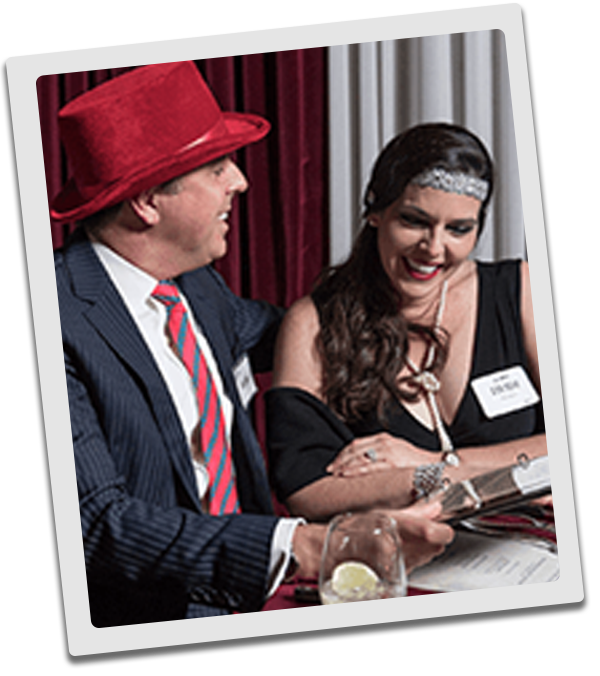 Orlando Murder Mystery couple checking out the dinner menu